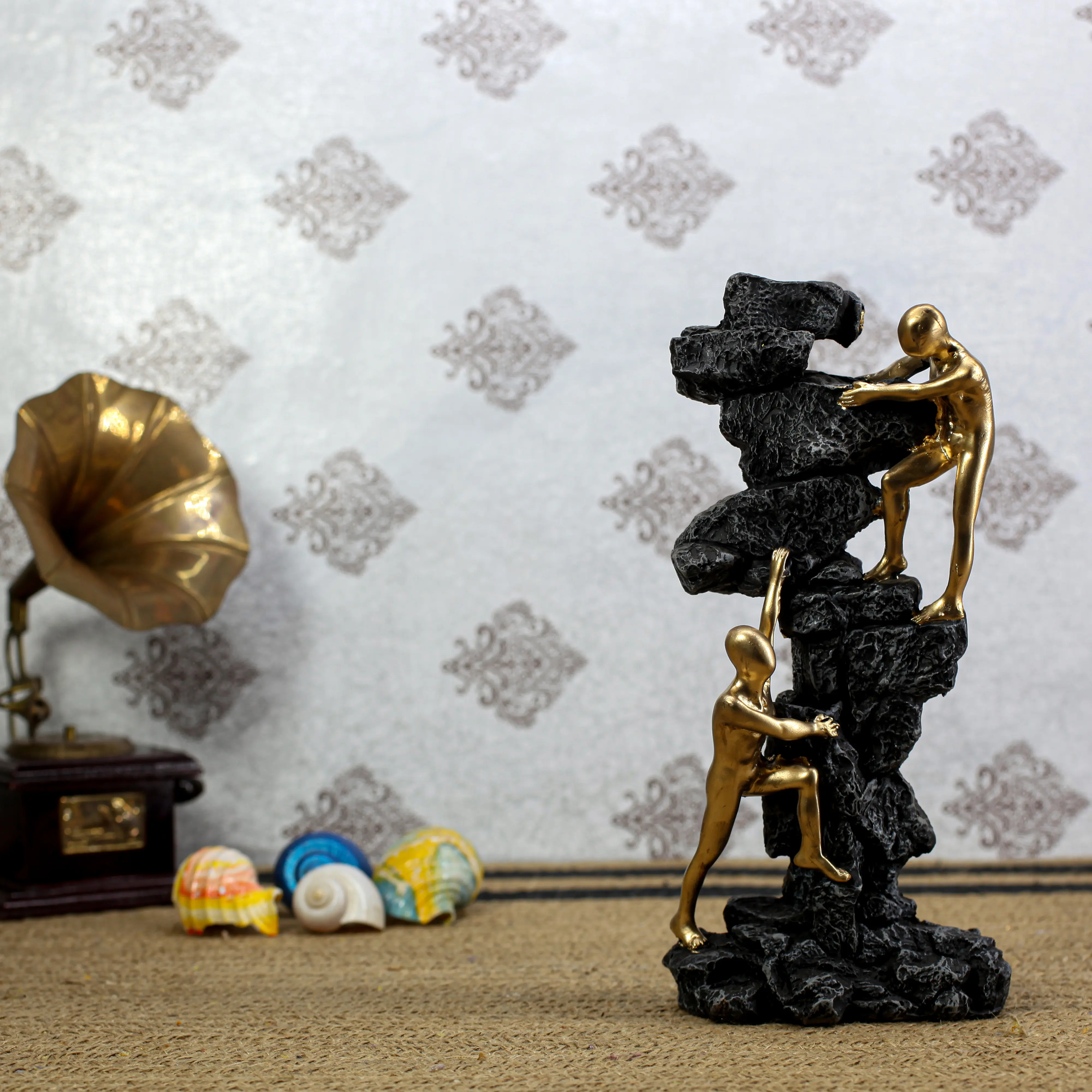 gold-climbing-men-statue-black-rock-success.jpg.